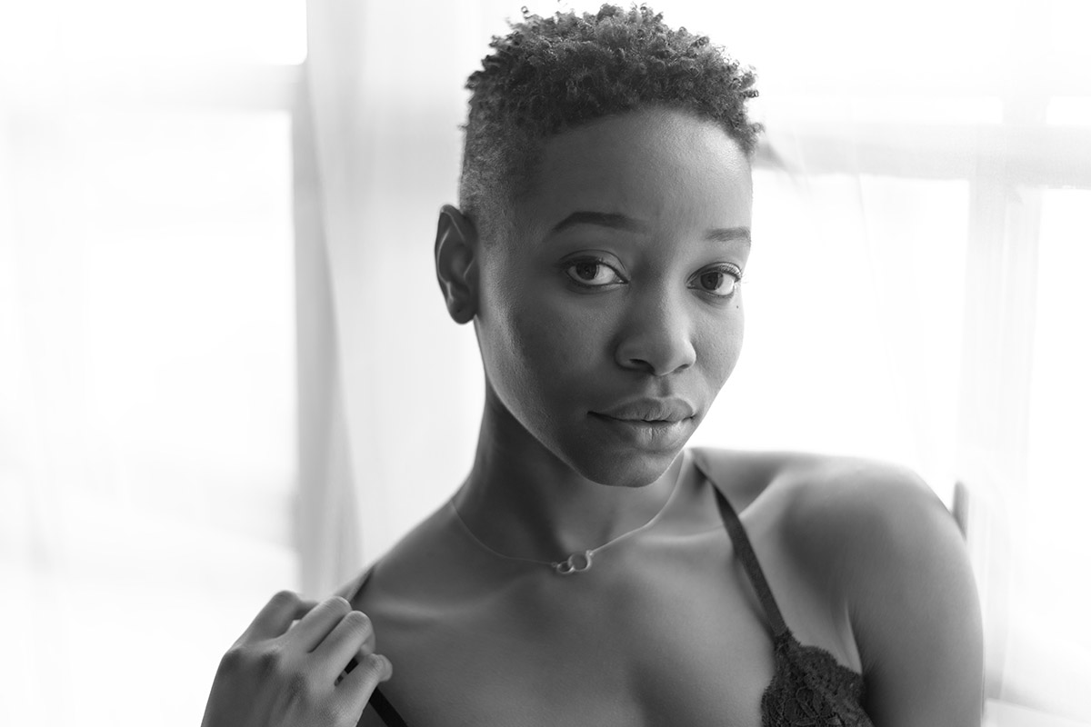 Black and white boudoir closeup of young black woman