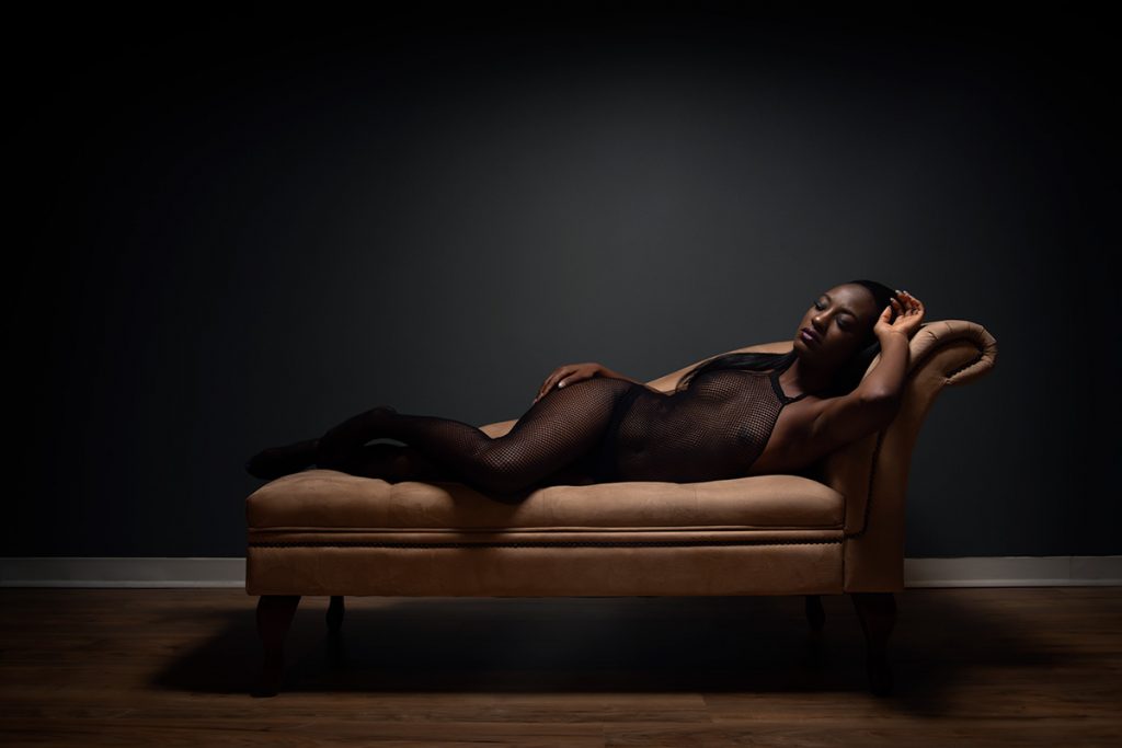 Moody boudoir on chaise lounge